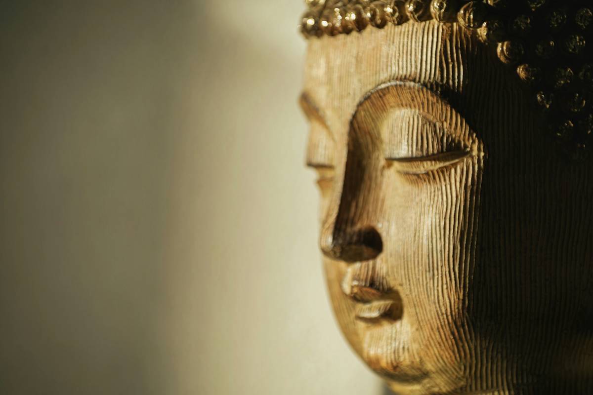 Woman meditating peacefully with headphones, practicing inner tranquility hypnosis for weight loss